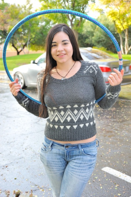 Chubby brunette takes off all her clothes in public while working a hula hoop