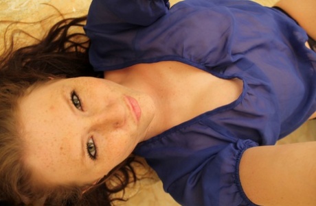 Amateur model Freckles 18 takes mirror selfies while getting naked