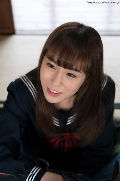 Japanese schoolgirl removes over the knee nylons before giving a footjob