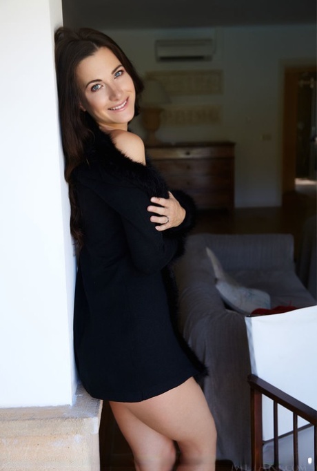 Dark haired teen Lauren Crist spreads her long legs while naked in heels