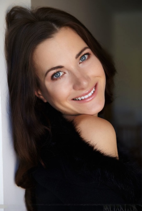 Dark haired teen Lauren Crist spreads her long legs while naked in heels