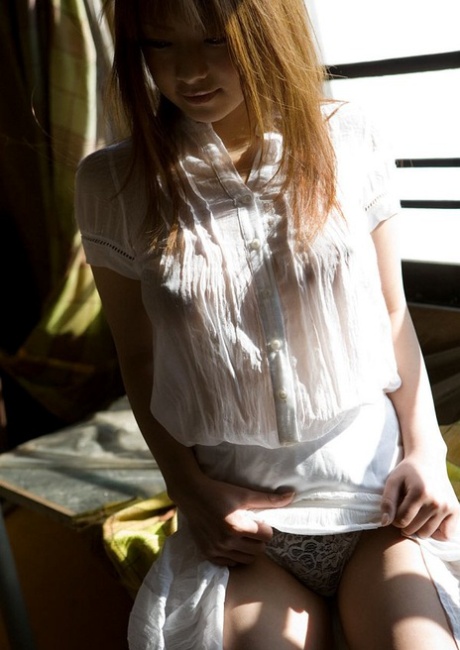 Hot Japanese teen Minor strikes great poses while modelling mostly naked