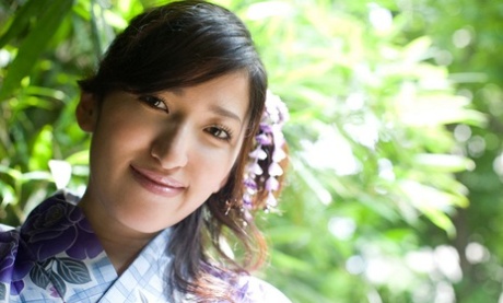 Young Japanese girl Ruru exposes her big naturals before flashing her panties