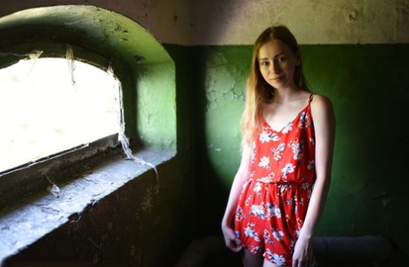 Tall teen Marika B strikes great nude poses in front of seaside window