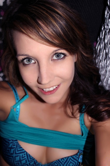 Slim young girl Andi Land pulls down her leggings while wearing mesh panties