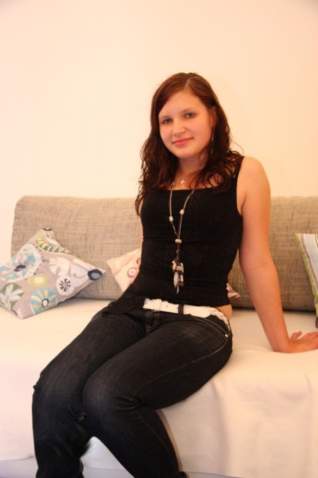 Young looking girl with pert titties makes her nude modelling debut on sofabed