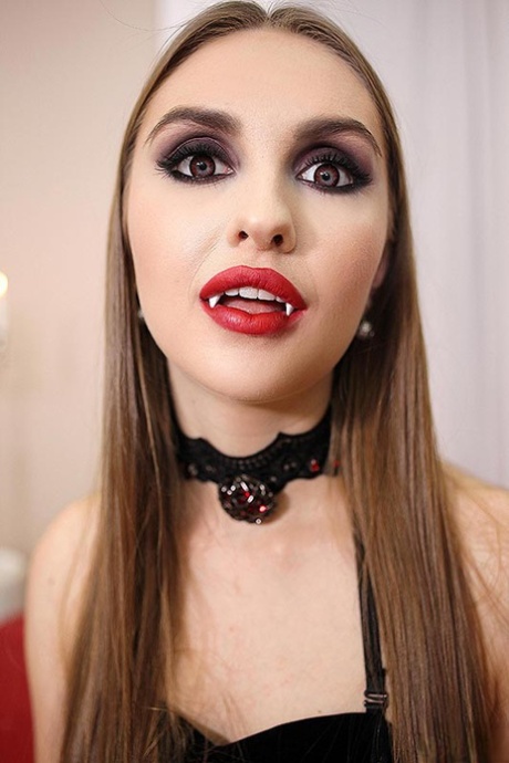 Goth girl Lena Reif sits atop her guy's dick after seducing him with her fangs