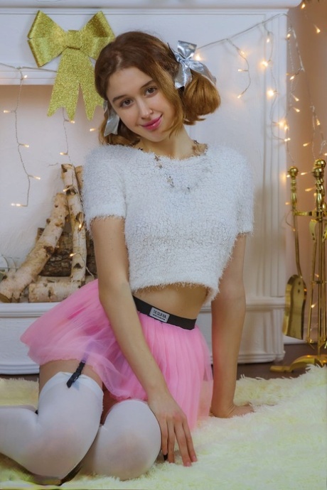 Adorable teen Riccarda strikes tempting solo poses in a tutu and stockings