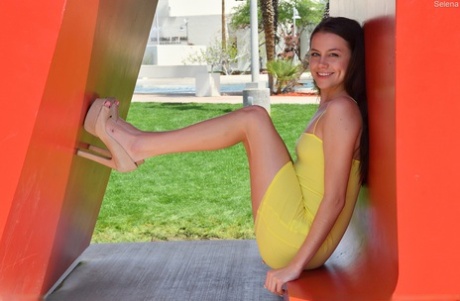 Sweet teen Selena fingers spreads her shaved pussy on a balcony with a view