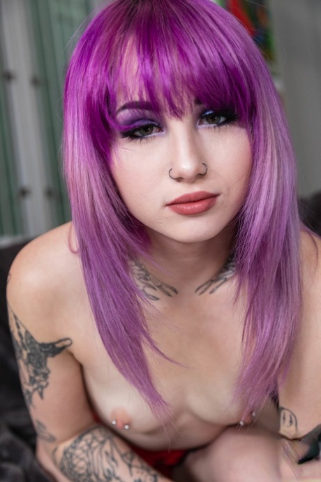 Tattooed girl with dyed hair gets banged during a bout of POV fucking
