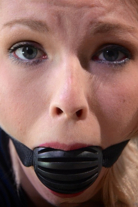 Blonde schoolgirl Ella Nova is rendered helpless in a dungeon
