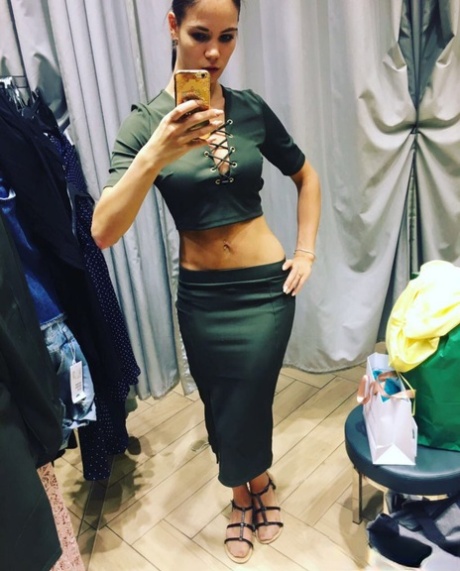 Amateur model Lovenia Lux takes clothed and topless selfies