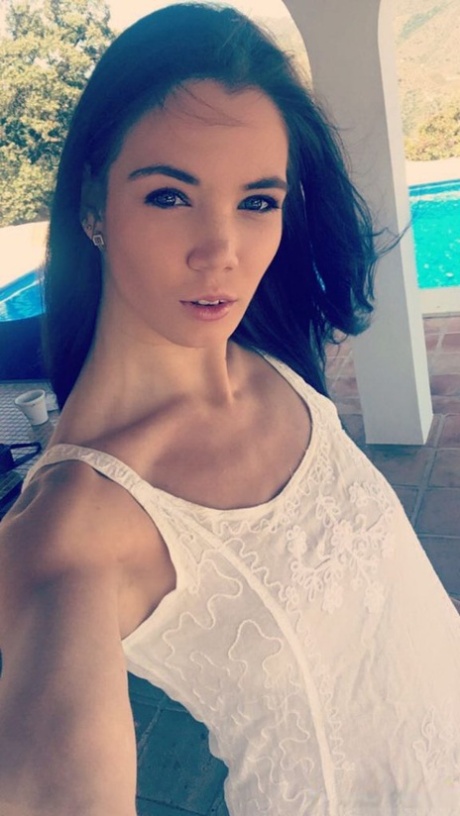 Amateur model Lovenia Lux takes clothed and topless selfies