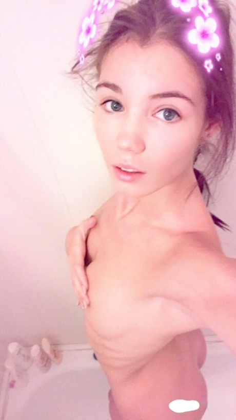 Amateur model Lovenia Lux takes clothed and topless selfies