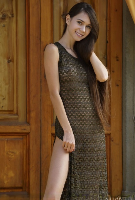 Leggy teen Leona Mia displays her slender body in the nude on steps