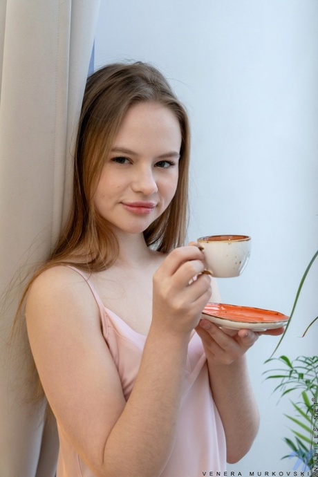 Sweet teen Venera Murkovski plays with her hairless pussy after getting naked