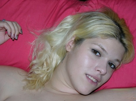 Chubby teen with blonde hair touts her twat and big ass at the same time
