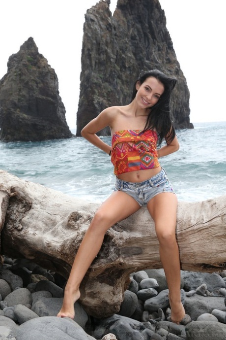 Beach babe Sapphira A exposing small teen boobs for outdoor glamour spread