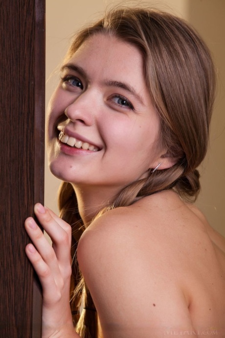 Blonde girl Sigrid in pigtails displaying her tiny tits and naked pussy