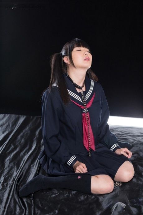 Young Japanese schoolgirl masturbates while giving oral sex