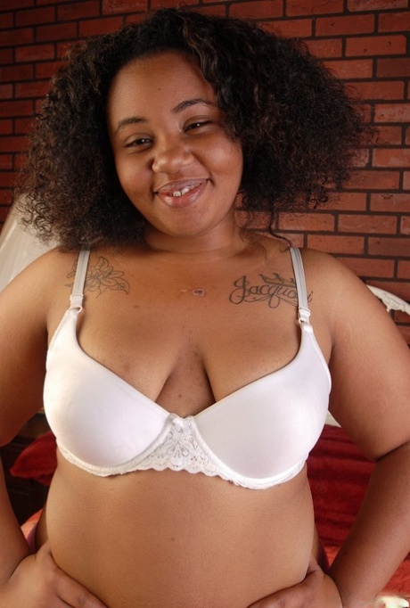 Stunning curly-haired ebony Champagne is showing off her tiny boobs