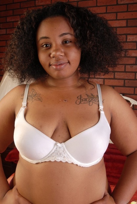 Stunning curly-haired ebony Champagne is showing off her tiny boobs