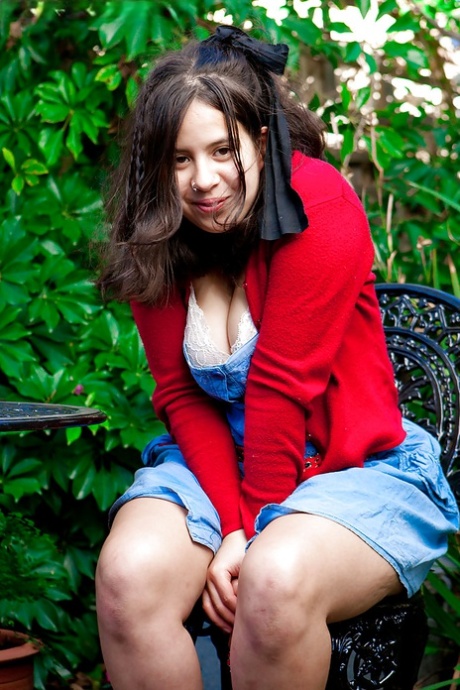 Young amateur girl Nikki S shows off her fat rolls after undressing outside