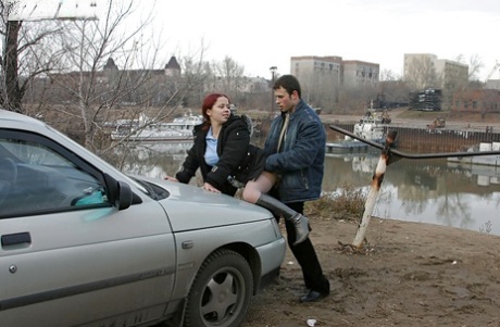 Redhead teenage lassie has some dirty fully clothed fun outdoor