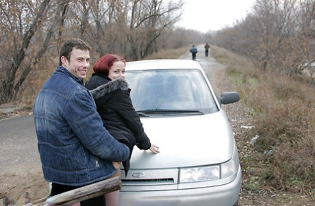 Redhead teenage lassie has some dirty fully clothed fun outdoor