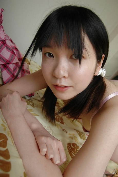 Shy asian teen stripping down and showcasing her gash in close up