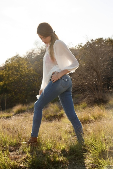 Alluring teen in jeans Gracie Thibble flashes her juicy natural tits outdoors