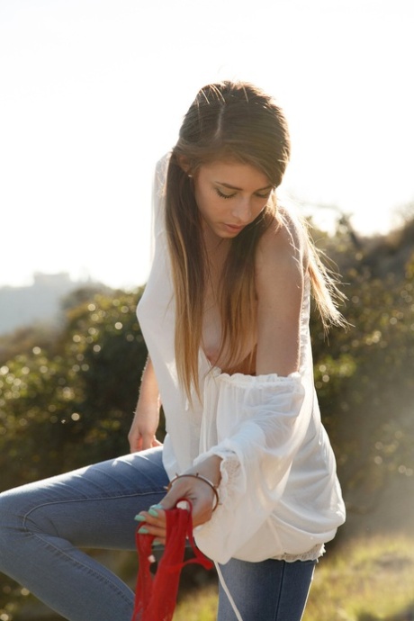 Alluring teen in jeans Gracie Thibble flashes her juicy natural tits outdoors