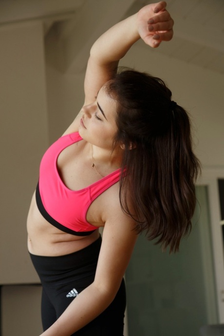 Acrobatic teen babe Kylie Quinn puts her sexy lingerie on and poses