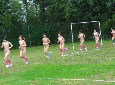 Asian female football team watches as a teammate gets fucked by the referees