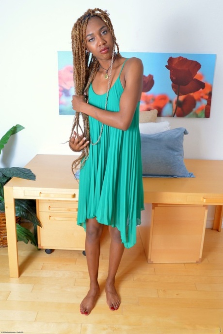 Beautiful skinny ebony Kimmy Katt strips and spreads her bushy twat
