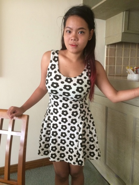 Nasty Asian girl with big tits takes her dress off and shows her hairy cunt
