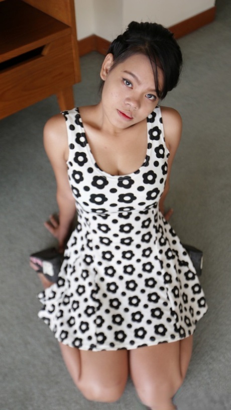 Nasty Asian girl with big tits takes her dress off and shows her hairy cunt