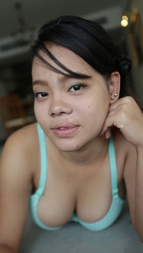 Nasty Asian girl with big tits takes her dress off and shows her hairy cunt