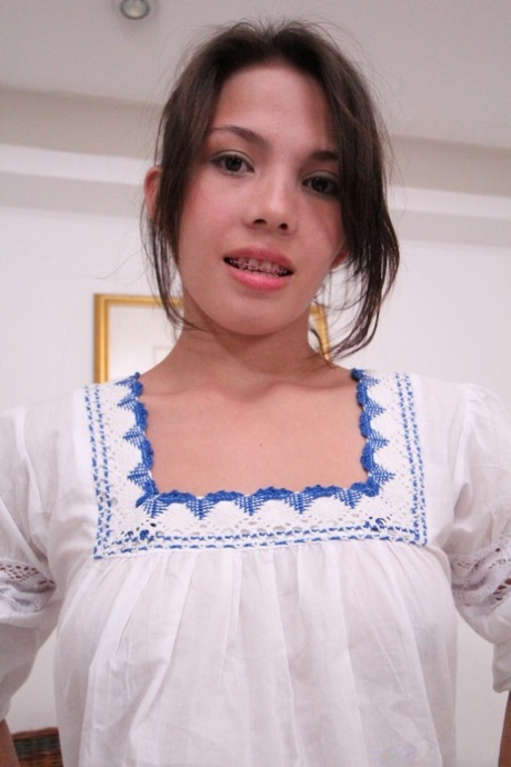 Asian cutie Ann loses her outfit and presents her tiny tits and twat