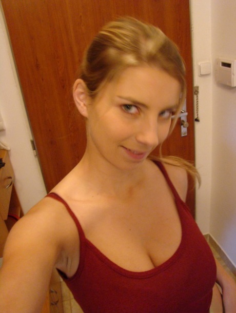 Young busty blonde Kathy displaying her large boobs & her great ass