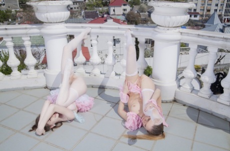Sweet slender teens Emily Bloom & Katie A show their tits & butts on a terrace