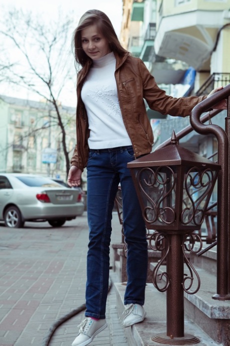Angelic cutie Ennu A lets her long hair hang loose after getting totally naked