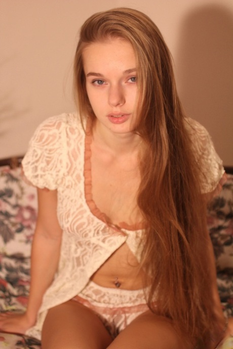 Beautiful teen Milena D removes her panties and exposes her furry coochie
