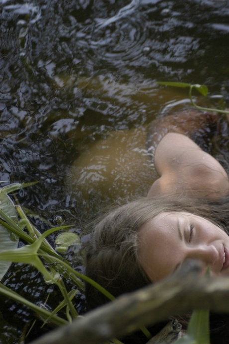 Kinky teen with nice curves Aneli A flaunts her large breasts in the river