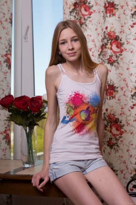 Skinny teen babe Rina E gets naked and exposes her hot body and feet
