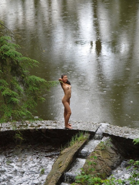 Exotic Asian babe Sofi playing buck naked in a hot romp at a public park