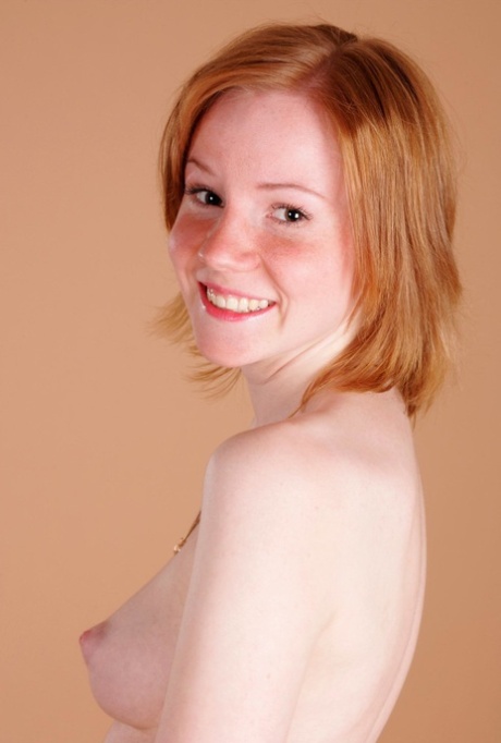Shy ginger teen Anne shows her tiny tits and ass in a solo show