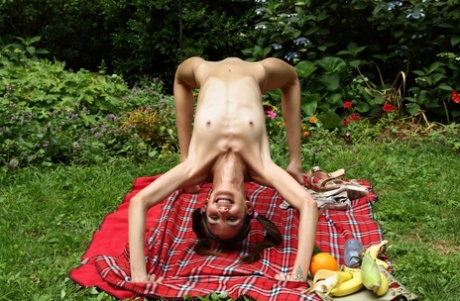 Slender sweetie with pigtails Natalia Nix undresses & masturbates at a picnic