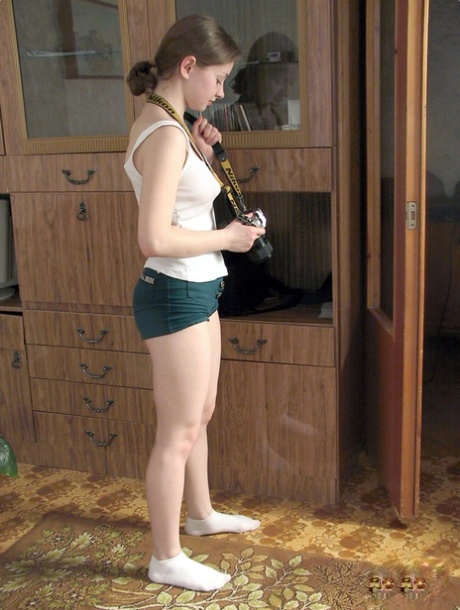 Horny amateur teens undress and photograph each other in the living room