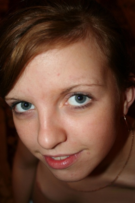 Cute amateur ginger Simona posing naked and spreading her pussy